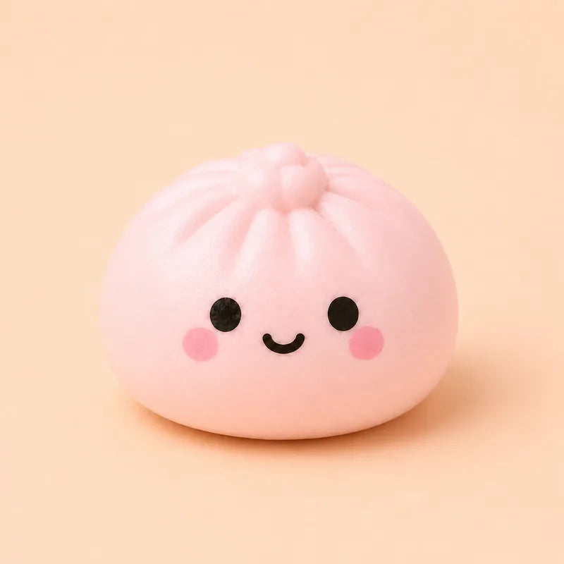 A pink bao bun squishy with a smiling face on a peach background