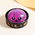 Halloween Mystery Dumpling Squishy in its decorated round case