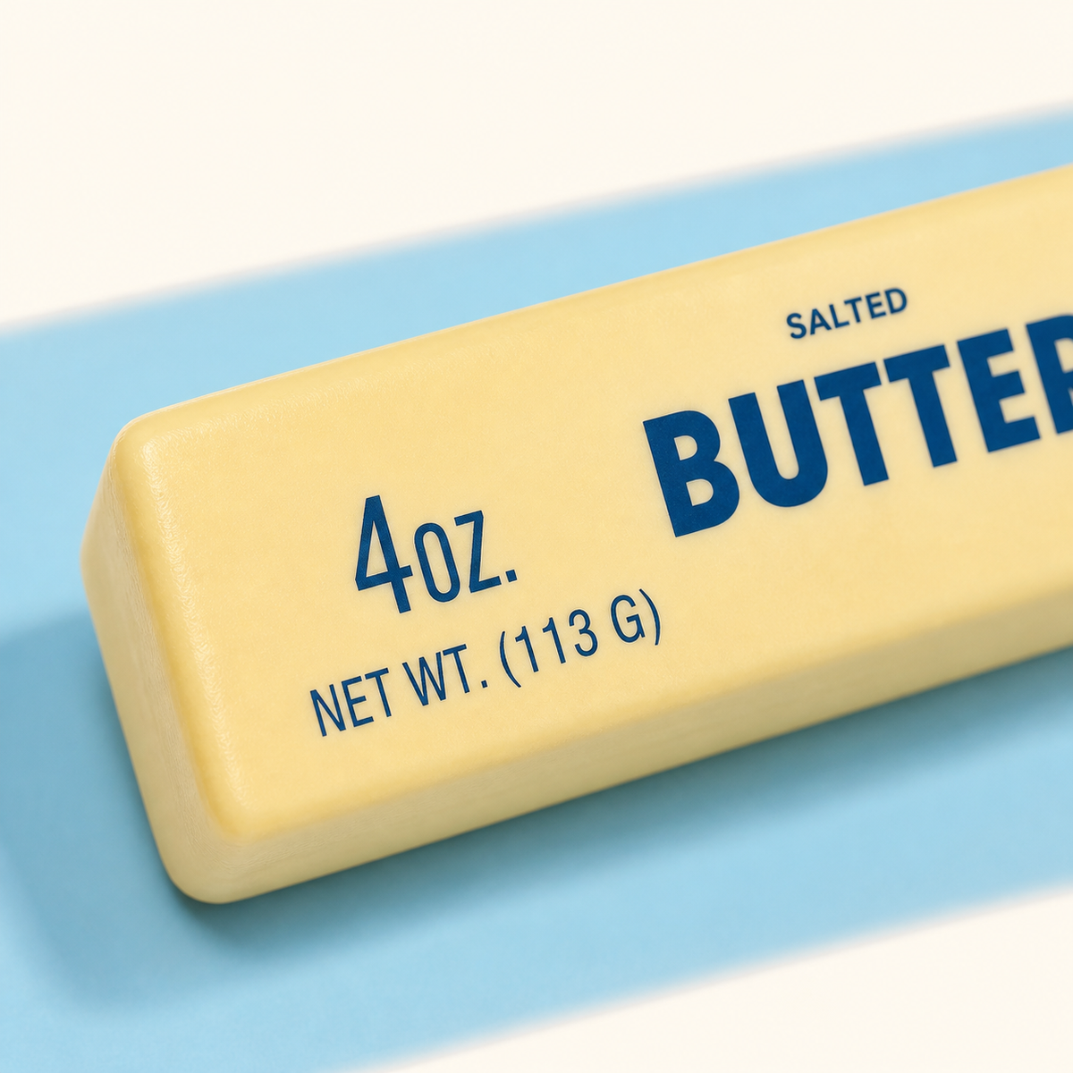 Close-up of the classic butter stick squishy's rounded edge and navy print