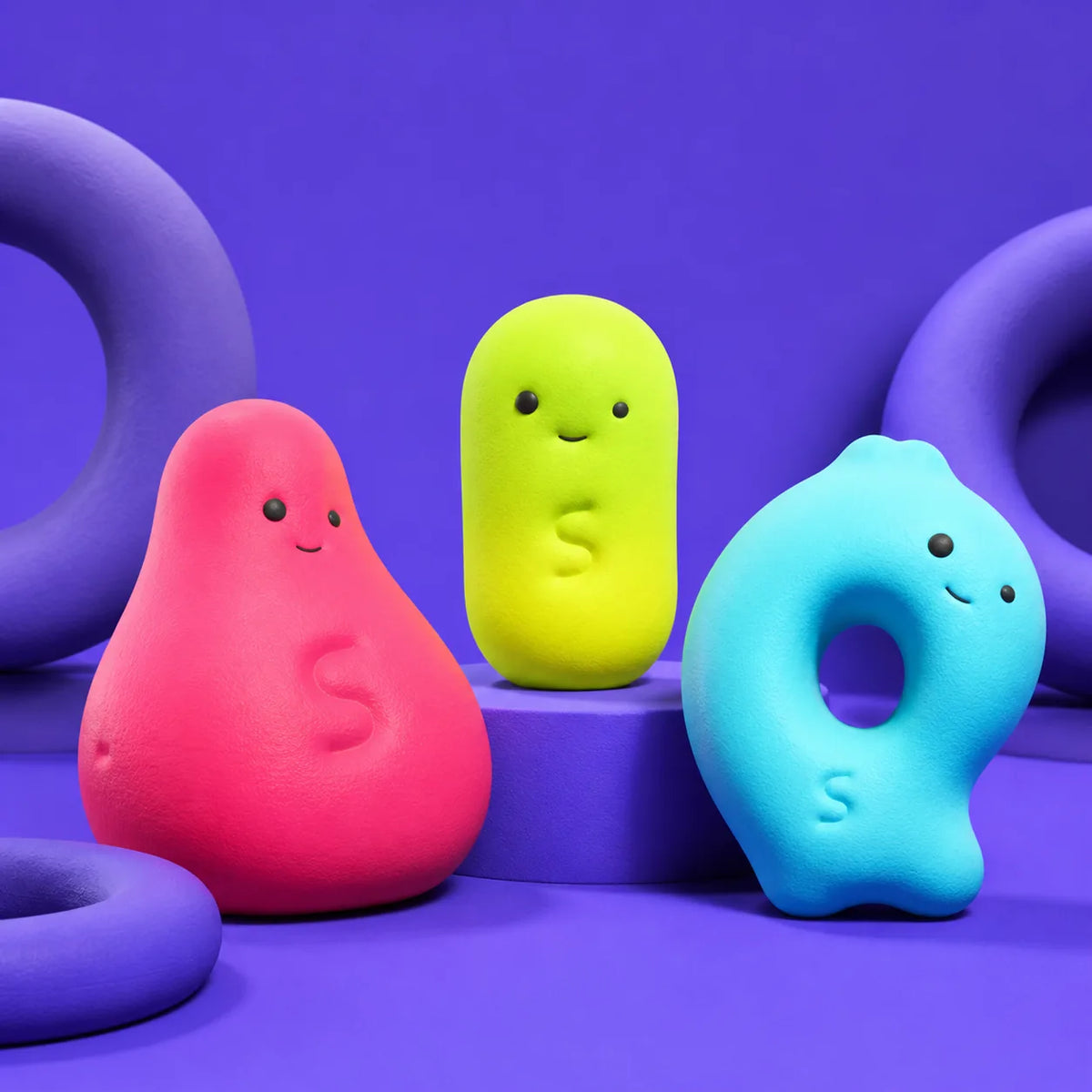 Three original Ssquishy Soft Club characters in a violet studio