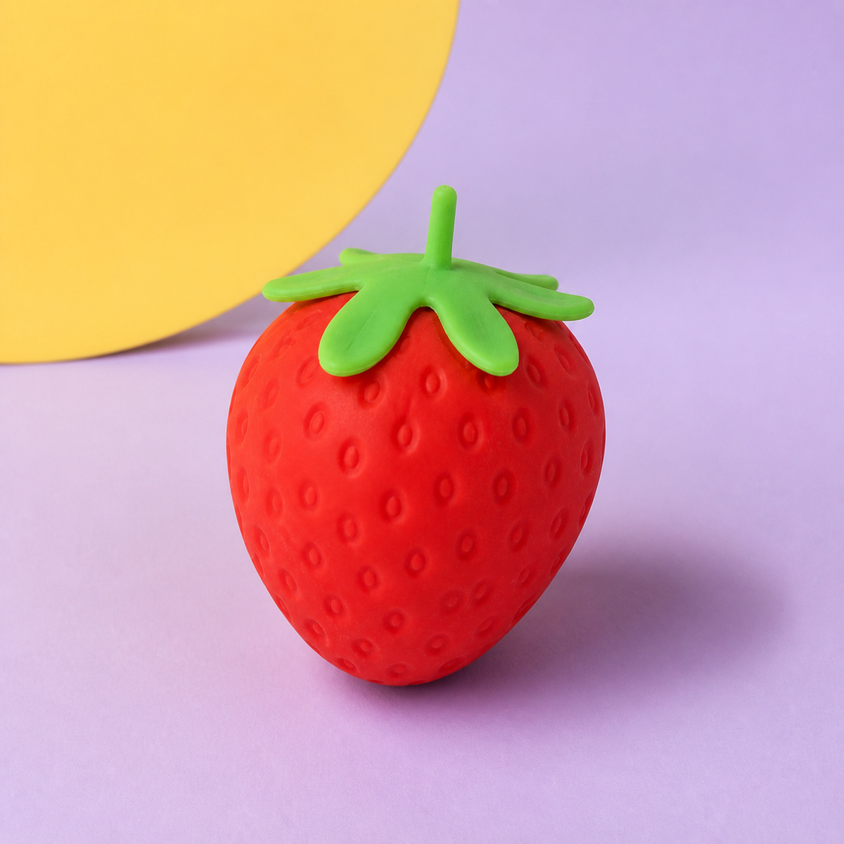 Strawberry Slow-Rise Squishy on a lilac campaign set with a butter-yellow circle