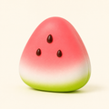 Watermelon Wedge Slow-Rise Squishy packshot with pink, white and green bands and three seeds